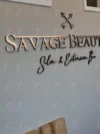 Custom laser cut 3D logo sign for beauty salons, dentist offices, and businesses, featuring raised design and precise craftsmanship